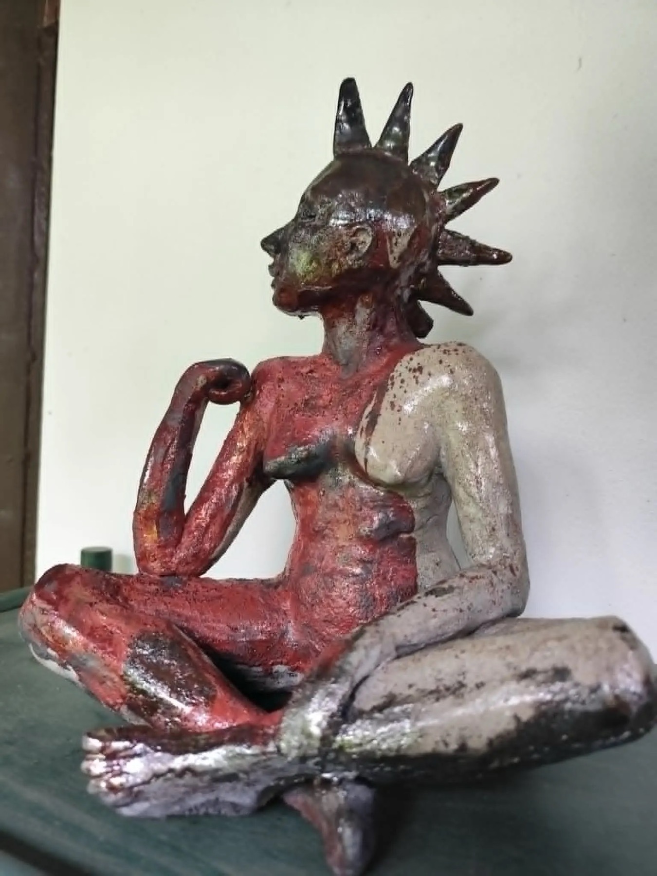 Ceramic Raku figure with red metallic glaze