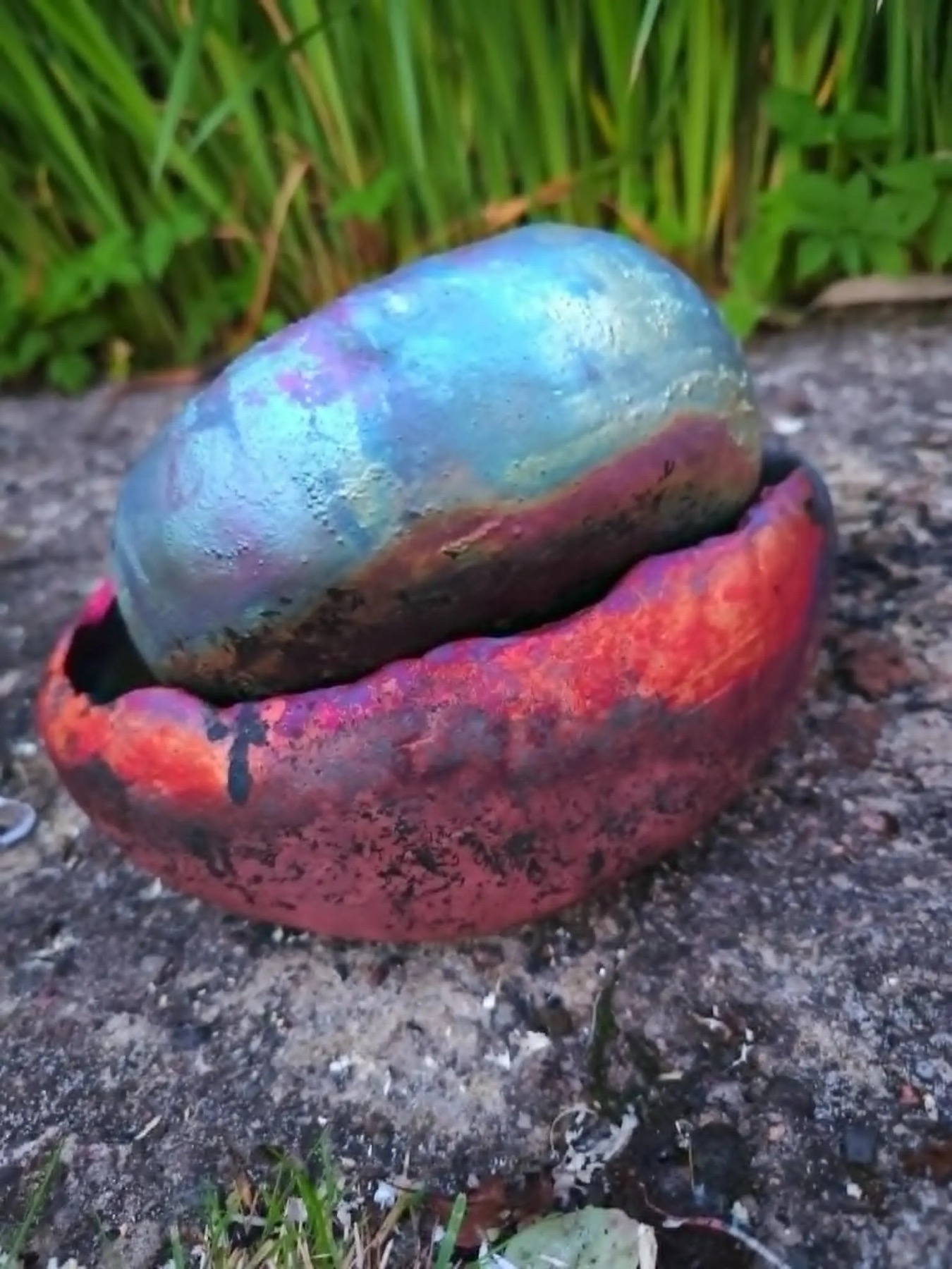 Raku ceramic vessel with blue and pink lustre